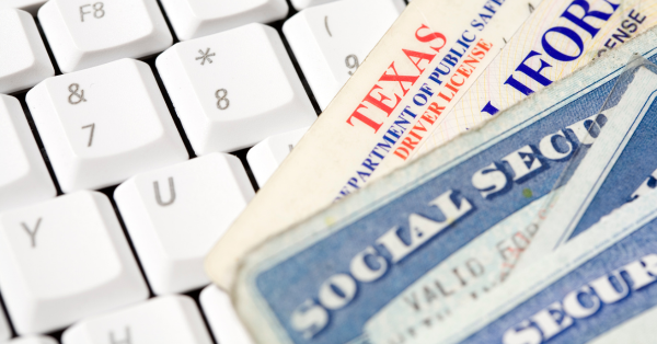 identification cards on top of a keyboard